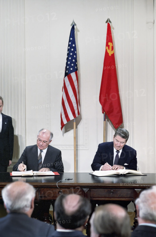 U.S. President Ronald Reagan and Soviet General Secretary Mikhail Gorbachev signing INF Treaty,  White House East Room, Washington, D.C., USA, President Ronald Reagan White House Photographic Office, December 8, 1987
