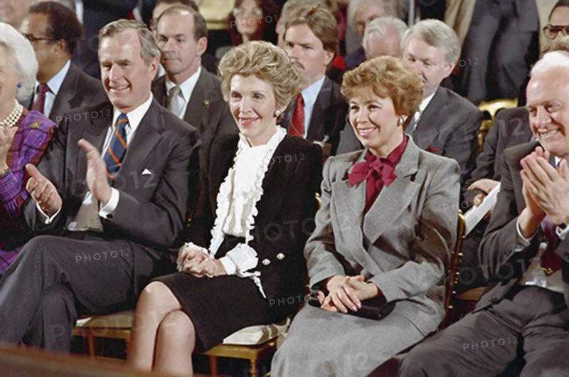 U.S. Vice President George H.W. Bush, U.S. First Lady Nancy Reagan and First Lady of the Soviet Union Raisa Gorbachev at signing of INF Treaty, White House East Room, Washington, D.C., USA, President Ronald Reagan White House Photographic Office, December 8, 1987
