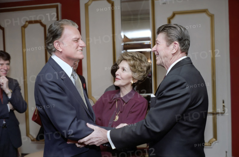 U.S. President Ronald Reagan, U.S. First Lady Nancy Reagan and American Evangelist Billy Graham at The National Prayer Breakfast, Washington Hilton Hotel, Washington, D.C., USA, President Ronald Reagan White House Photographic Office, February 5, 1981