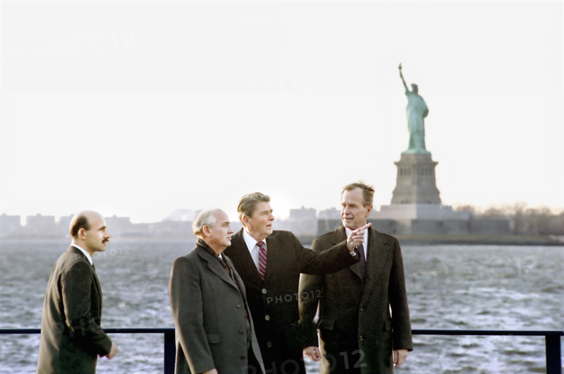 U.S. President Ronald Reagan and U.S. Vice President/U.S. President-elect George H.W. Bush with Soviet General Secretary Mikhail Gorbachev, Governors Island with Statue of Liberty in background, New York City, New York, USA, President Ronald Reagan White House Photographic Office, December 7, 1988