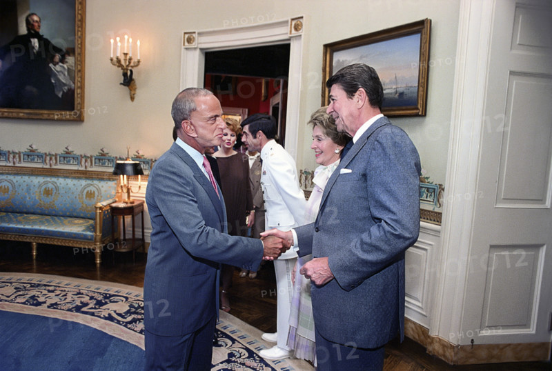 U.S. President Ronald Reagan and U.S. First Lady Nancy Reagan with American lawyer Roy Cohn during reception for Eureka College Scholarship committee and donors, White House Blue Room, Washington, D.C., USA, President Ronald Reagan White House Photographic Office, June 28, 1982
