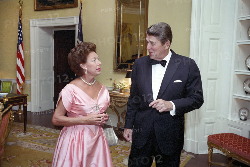 U.S. President Ronald Reagan talking with Princess Margaret of the United Kingdom at a private dinner in her honor, White House private residence, Washington, D.C., USA, President Ronald Reagan White House Photographic Office, October 1, 1983