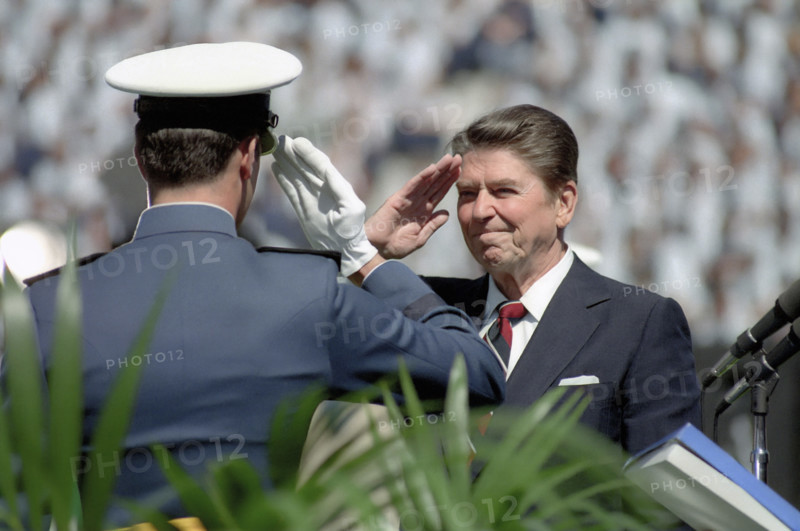 U.S. President Ronald Reagan saluting Air Force cadet at United States Air Force Academy commencement, Colorado Springs, Colorado, USA, President Ronald Reagan White House Photographic Office, May 30, 1984