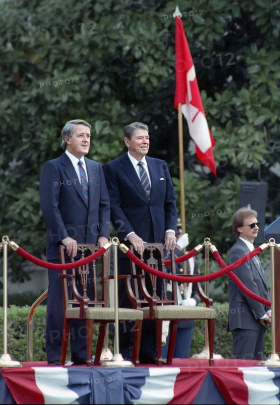 U.S. President Ronald Reagan with Prime Minister Brian Mulroney of Canada during Mulroney's arrival ceremony on White House South Lawn, Washington, D.C., USA, President Ronald Reagan White House Photographic Office, April 27, 1988