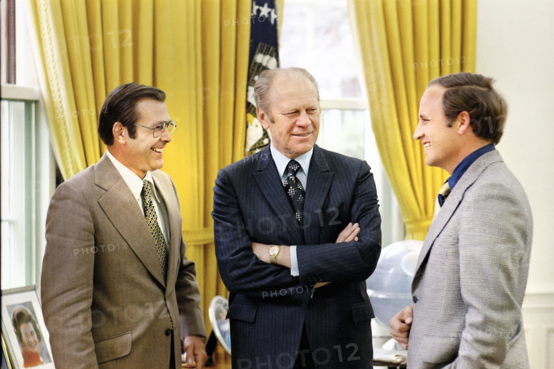 U.S. President Gerald R. Ford chatting with Chief of Staff Donald Rumsfeld and Rumsfeld’s Assistant Richard Cheney in the White House Oval Office, Washington, D.C., USA, Gerald R. Ford White House Photographs, April 28, 1974