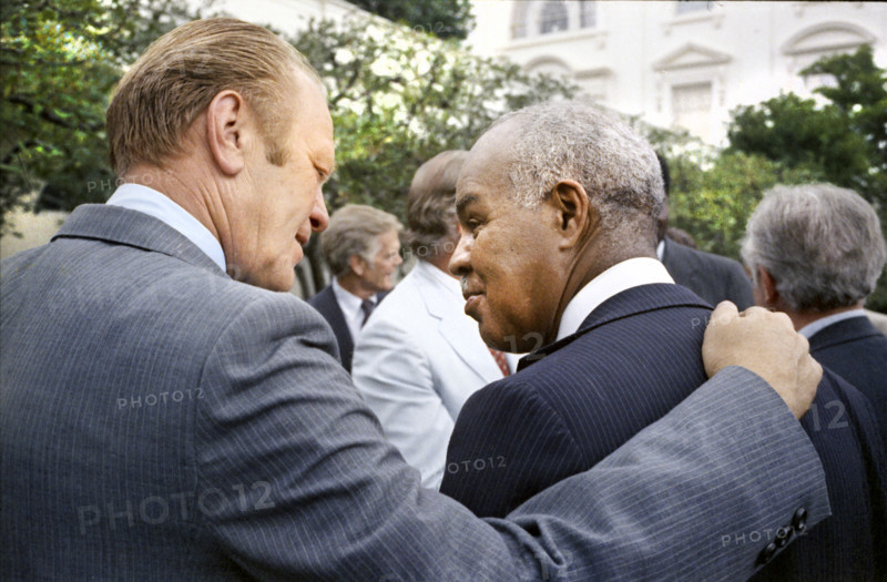 U.S. President Gerald R. Ford and American civil rights leader Roy Wilkins following signing ceremony for H.R. 6219, extending Voting Rights Act of 1965, White House Rose Garden, Washington, D.C., USA, August 6, 1975