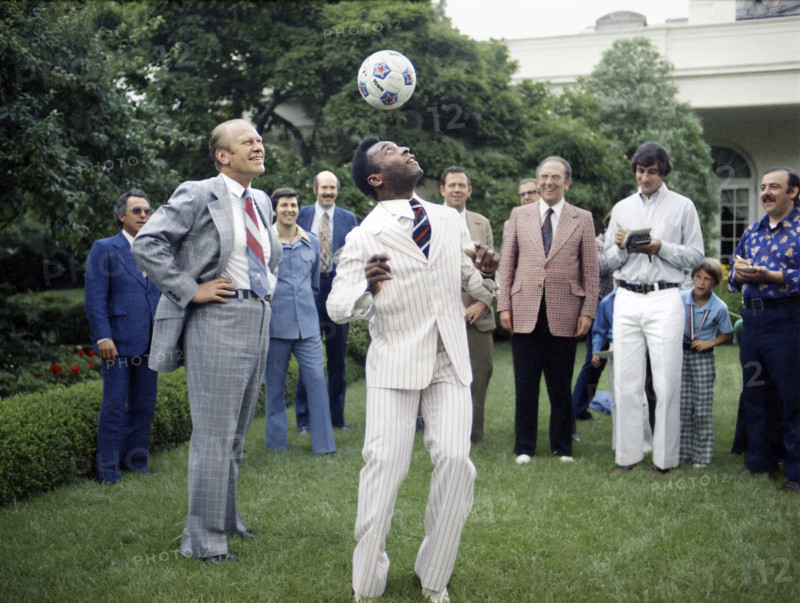 U.S. President Gerald R. Ford watching Pele head a soccer ball in the White House Rose Garden, Washington, D.C., USA, Gerald R. Ford White House Photographs, June 28, 1975