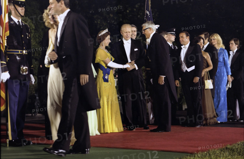 U.S. President Gerald R. Ford and Queen Elizabeth II of Great Britain greeting actor Cary Grant in the receiving line on White House south Driveway prior to state dinner honoring Her Majesty and Prince Philip, Washington, D.C., USA, Gerald R. Ford White House Photographs, July 7, 1976