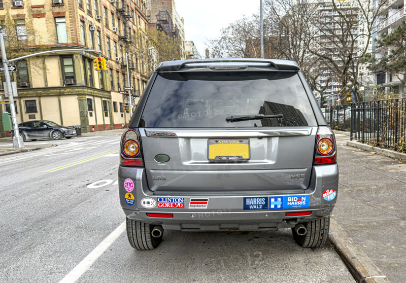 Parked car with various political bumper stickers, Manhattan, New York City, New York, USA
