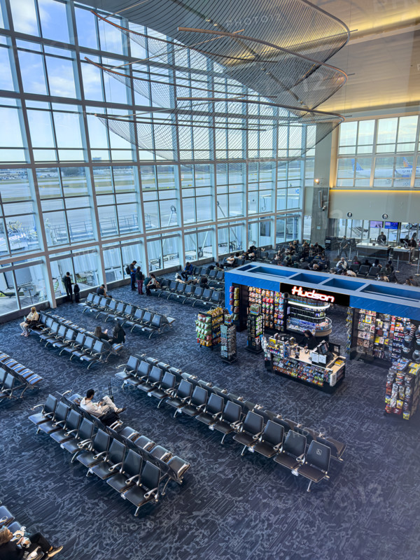 High angle view of travelers relaxing in departure lounge, Delta Airlines, Fort Lauderdale-Hollywood International Airport, Fort Lauderdale, Florida, USA