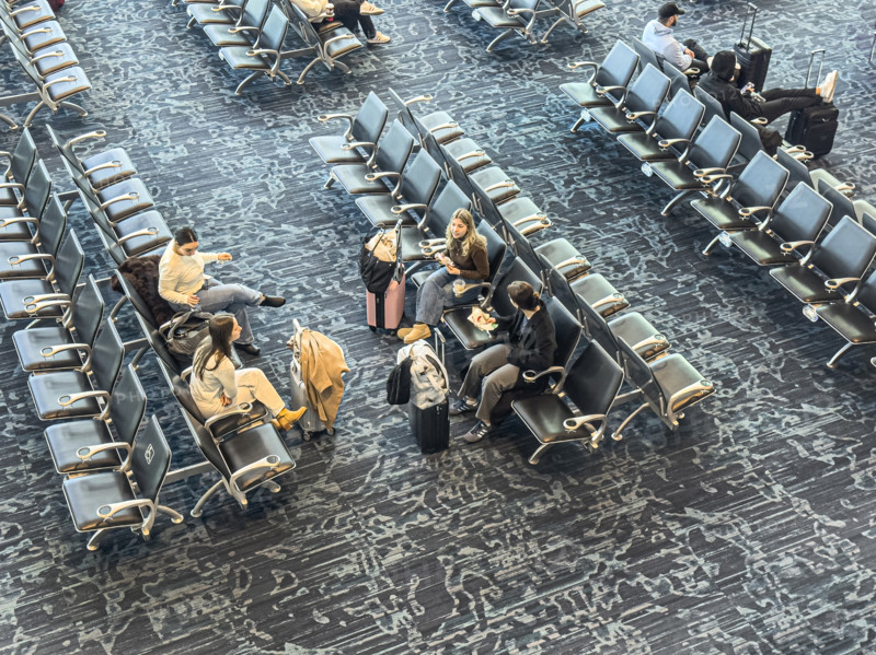 High angle view of travelers relaxing in departure lounge, Delta Airlines, Fort Lauderdale-Hollywood International Airport, Fort Lauderdale, Florida, USA
