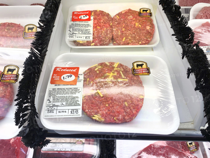 Reduced priced beef hamburger patties in grocery store
