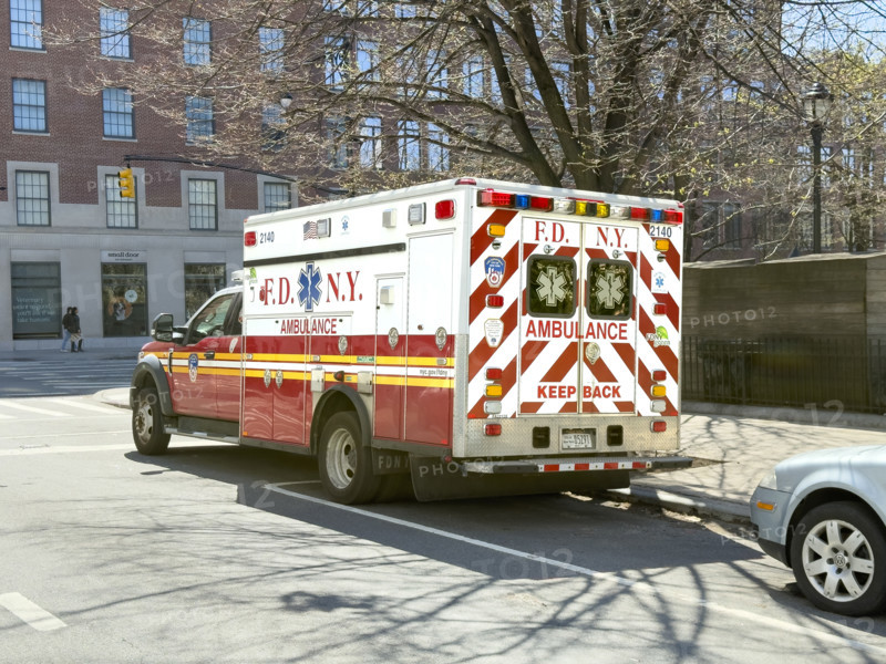 New York City Fire Department EMS ambulance parked on urban street, Chelsea, Manhattan, New York City, New York, USA