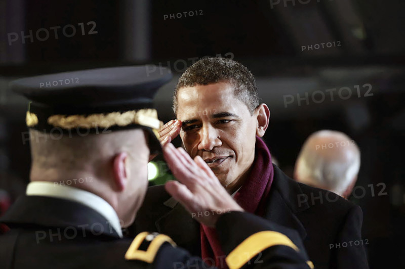 U.S. President Barack Obama saluting military officer during Inaugural Parade ceremonies, Pennsylvania Avenue, Washington, D.C., USA, Pete Souza, Office of White House Photography, January 20, 2009