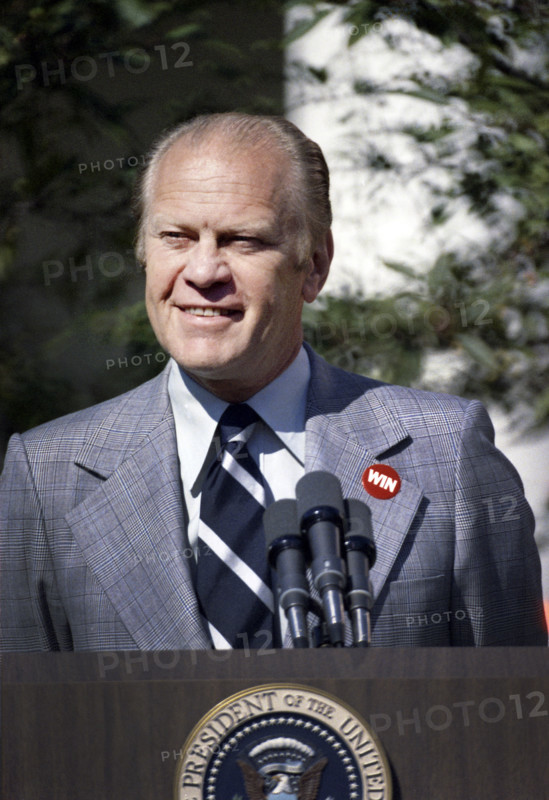 U.S. President Gerald R. Ford wearing a WIN (Whip Inflation Now) button at his second press conference,  White House Rose Garden, Washington, D.C., USA, Gerald R. Ford White House Photographs, October 9, 1974