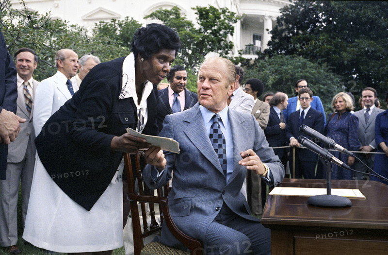 U.S. President Gerald R. Ford and U.S. Representative Barbara Jordan of Texas at signing Ceremony for H.R. 6219, extending the Voting Rights Act of 1965, White House Rose Garden, Washington, D.C., USA, Gerald R. Ford White House Photographs, August 6, 1975
