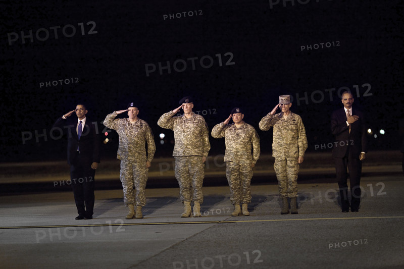 U.S. President Barack Obama and U.S. Attorney General Eric Holder attending ceremony for the dignified transfer of 18 U.S. personnel who died in Afghanistan, Dover Air Force Base, Dover, Delaware, USA, Pete Souza, Office of White House Photography Office, October 29, 2009