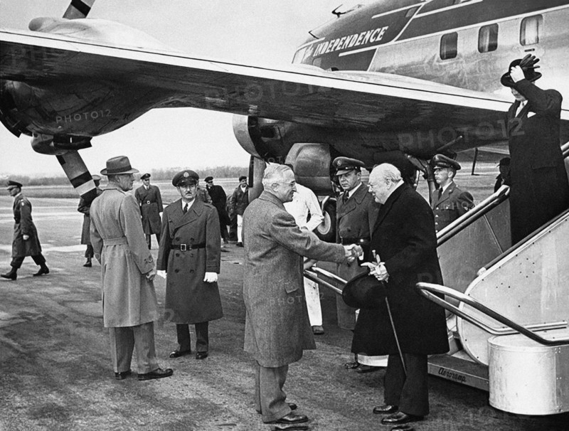 U.S. President Harry S. Truman greeting British Prime Minister Winston (with British Foreign Minister Anthony Eden on steps) after Churchill arrived at Washington National Airport on board President Truman's airplane, "The Independence", Washington, D.C., USA, Abbie Rowe, National Parks Service, Harry S. Truman Library, January 5, 1952