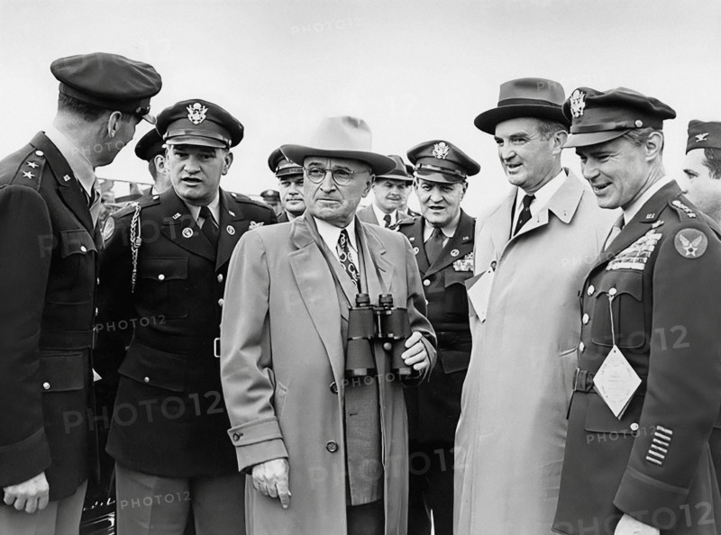 U.S. President Harry S. Truman (center, with binoculars) attending Air Progress Demonstration. From left: U.S. General Laurence Kuter, U.S. General Robert B. Landry, President Truman, U.S. General Harry H. Vaughan, U.S. Secretary Stuart Symington, and U.S. General Hoyt Vandenberg, Andrews Air Force Base, Prince George's County, Maryland, USA, Abbie Rowe, National Parks Service, Harry S. Truman Library, February 15, 1949