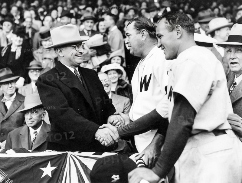 U.S. President Harry S. Truman (left) shaking hands with Washington Senators starting pitcher Bobo Newsom (center) and New York Yankees starting pitcher Allie Reynolds (right) on opening day of the baseball season, Griffith Stadium, Washington, D.C., USA, Abbie Rowe, National Parks Service, Harry S. Truman Library, April 18, 1947