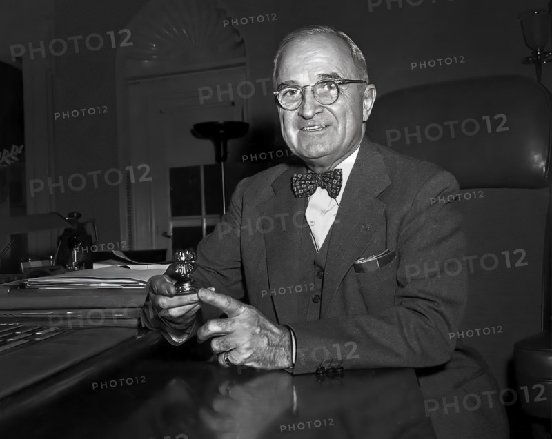 U.S. President Harry S. Truman sitting at his desk with paperweight, a gift to him from a 4-H group, White House Oval Office, Washington, D.C., USA, Abbie Rowe, National Parks Service, Harry S. Truman Library, January 8, 1953
