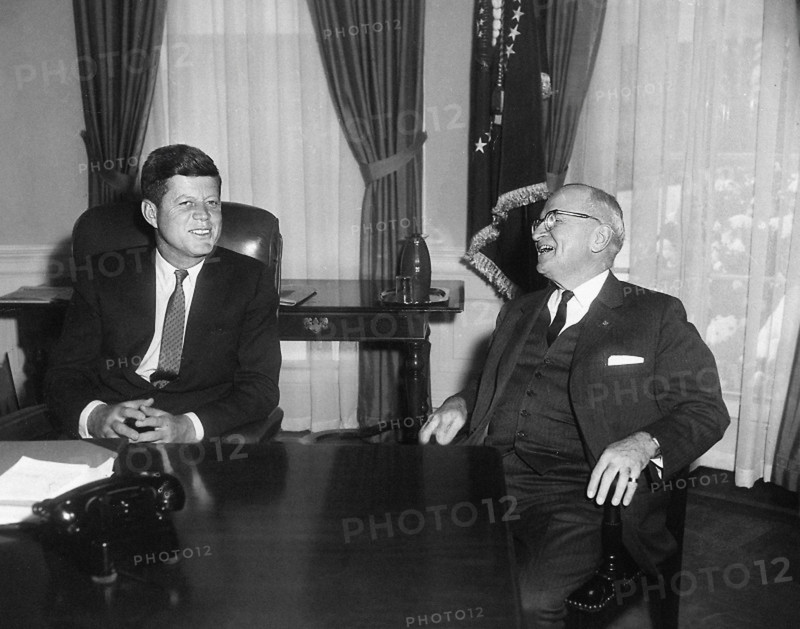 U.S. President John F. Kennedy (left) talking with former U.S. President Harry S. Truman (right) in White House Oval Office on Kennedy's first full day in office, Washington, D.C., USA, Abbie Rowe, National Parks Service, Harry S. Truman Library, January 21, 1961