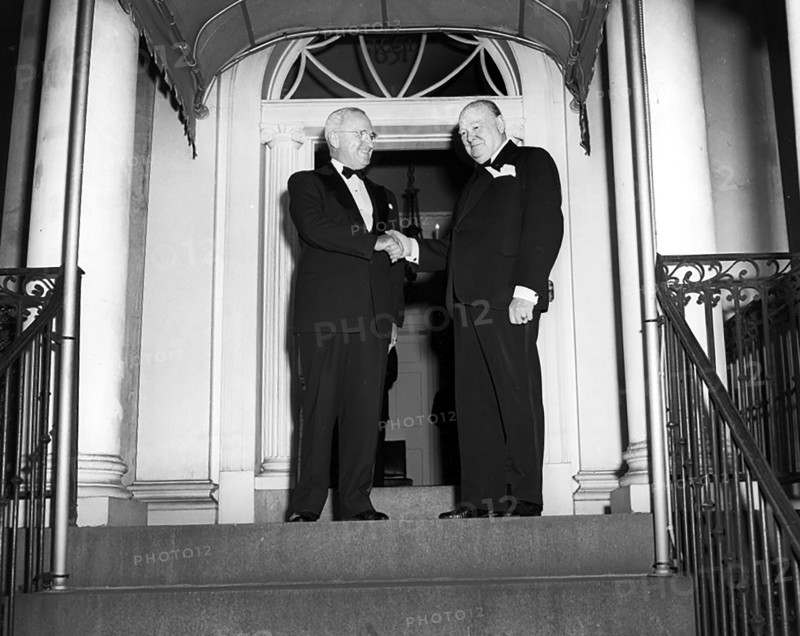 U.S. President Harry S. Truman (left) and British Prime Minister Winston Churchill (right) shaking hands outside Blair House, Washington, D.C., USA, Abbie Rowe, National Parks Service, Harry S. Truman Library, March 24, 1949