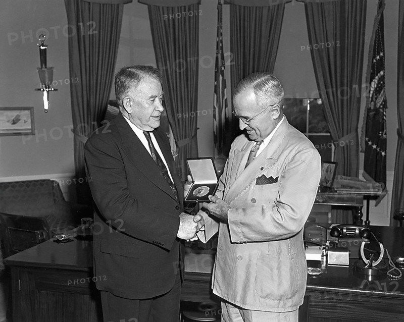 President Harry S. Truman (right) presents a Congressional Gold Medal, authorized by Congress, to U.S. Vice President Alben Barkley, White House Oval Office, Washington, D.C., USA, Abbie Rowe, National Parks Service, Harry S. Truman Library, June 2, 1950