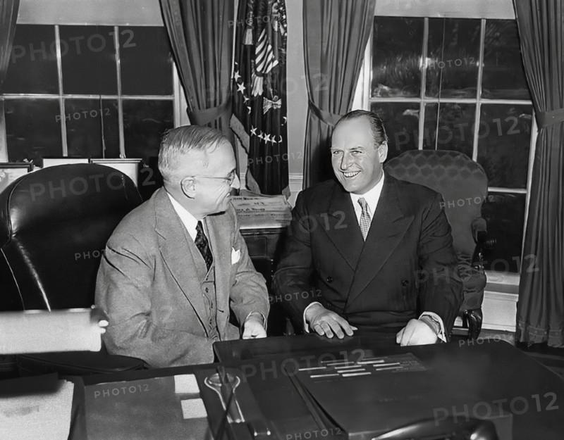 U.S. President Harry S. Truman (left) at his desk with Crown Prince Olav of Norway (right) in the White House Oval Office, Washington, D.C., USA, Abbie Rowe, National Parks Service, Harry S. Truman Library, November 20, 1950