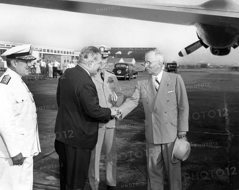 U.S. President Harry S. Truman shaking hands with Brazilian Ambassador Carlos Martins as they prepare to board the presidential airplane for a flight to Brazil, Washington National Airport, Washington, D.C., USA, Abbie Rowe, National Parks Service, Harry S. Truman Library, August 31, 1947