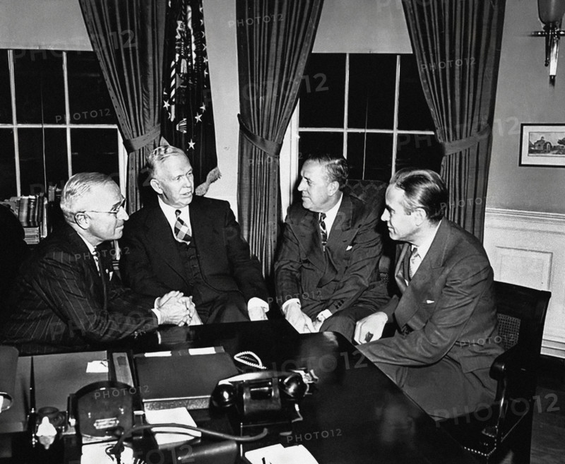 U.S. President Harry S. Truman, Secretary of State George C. Marshall, Economic Cooperation Administrator Paul Hoffman, and Ambassador Averell Harriman discussing Marshall Plan White House Oval Office, Washington DC, USA, Abbie Rowe, National Parks Service, Harry S. Truman Library, November 29, 1948