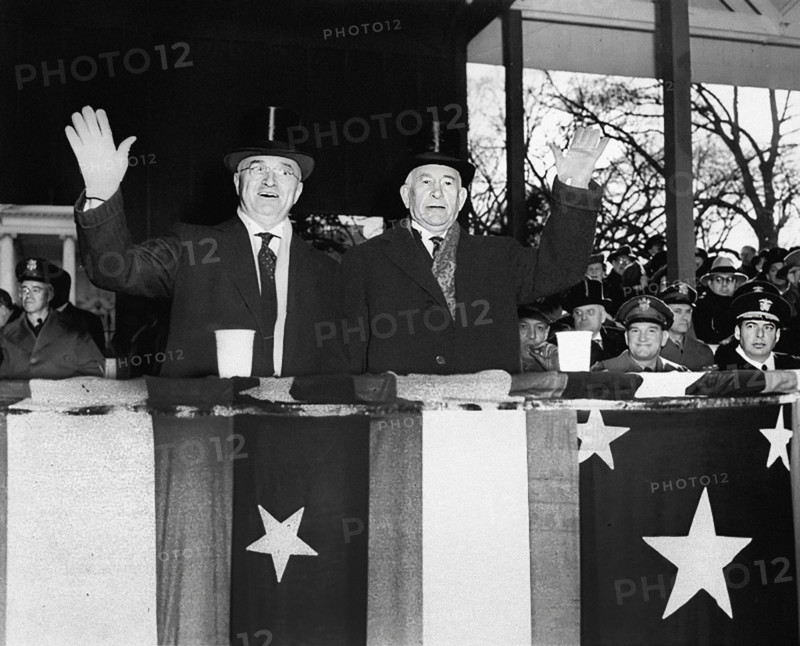 U.S. President Harry S. Truman (left) and U.S. Vice-President Alben Barkley (right) waving from reviewing stand during Inaugural Parade, Washington, D.C., USA, Abbie Rowe, National Parks Service, Harry S. Truman Library, January 20, 1949
