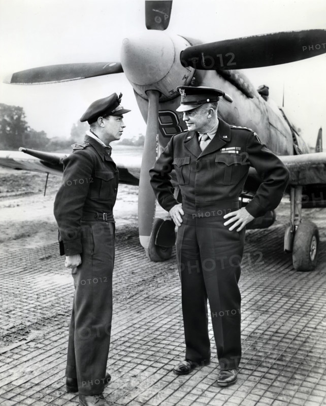 U.S. General Dwight D. Eisenhower talking to flight officer A. K. Asbos, Brisbane, Australia, in France, when the General made trip there by plane to get on-the-spot-reports of the new offensive against the Germans, Normandy, France, U.S. Army Signal Corps, July 26, 1944