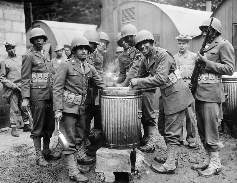 African American soldiers drawing rations at camp cook house, Northern Ireland, U.S. Office of War Information, August 1942