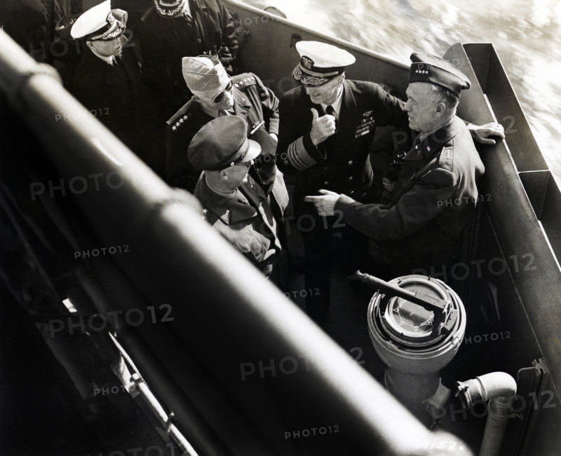 U.S. General Dwight D. Eisenhower, U.S. General Henry Arnold, U.S. Admiral Ernest King and U.S. General George Marshall, America's top-ranking military officers in the European Theater of Operations, aboard landing craft enroute to inspect American installations, Normandy, France, U.S. Army Signal Corps, June 14, 1944