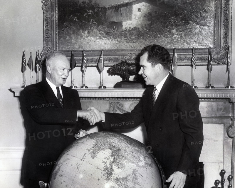 U.S. Vice President Richard M. Nixon shaking hands  while meeting with U.S. President Dwight D. Eisenhower before Nixon's departure on Far East good will tour, White House, Washington, D.C., USA, National Parks Service, Dwight D. Eisenhower Library, October 5, 1953