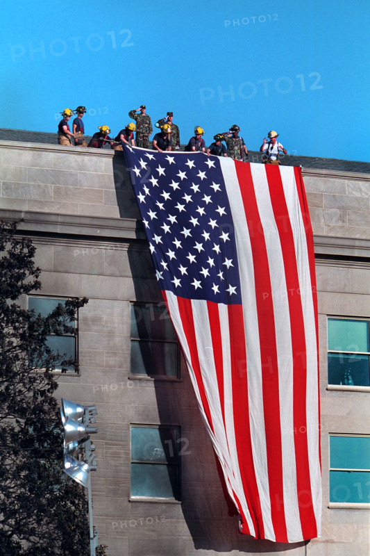 Firefighters hanging large American flag from roof of Pentagon near crash site of American Airlines Flight 77, Arlington County, Virginia, USA, Paul Morse, George W. Bush White House Photo Office, September 12, 2001