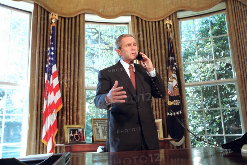 U.S. President George W. Bush talking on telephone with New York Governor George Pataki and New York City Mayor Rudolph Giuliani, White House Oval Office, Washington, D.C., USA, Paul Morse, George W. Bush White House Photo Office, September 13, 2001