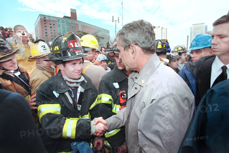 U.S. President George W. Bush greeting firefighters, police and rescue personnel at World Trade Center disaster site, Financial District, Manhattan, New York City, New York, USA, Paul Morse, George W. Bush White House Photo Office, September 14, 2001