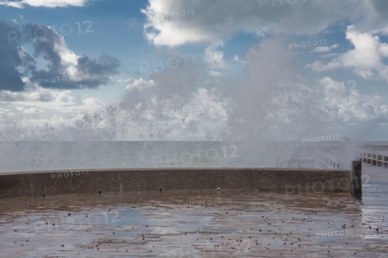 Wave flooding the dyke