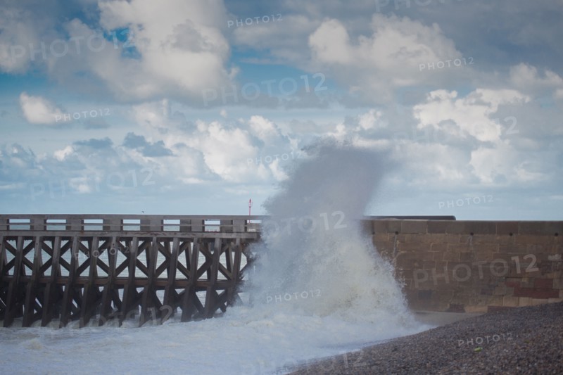 Wave flooding the dyke