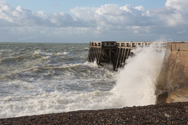 Wave flooding the dyke