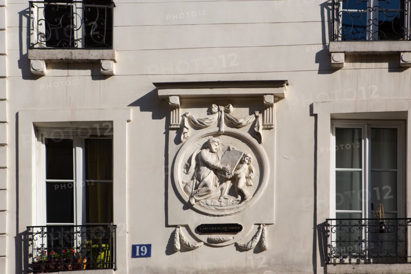 Paris, carved detail on a building located rue du Cherche Midi