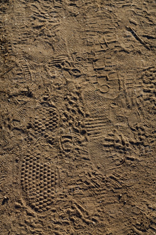 Hikers' footprints on the coastal path, Le Conquet, North tip of Finistère