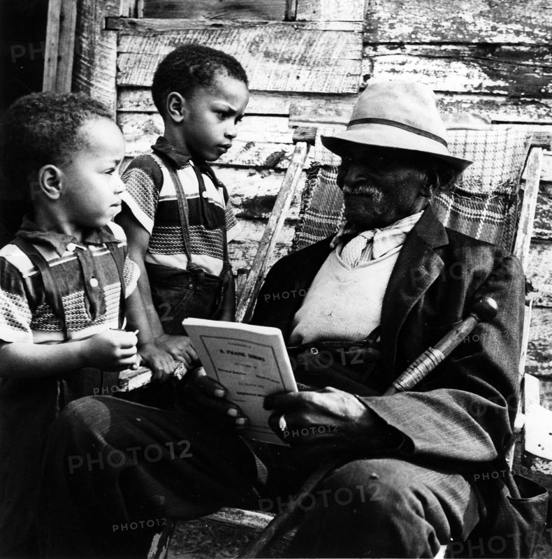 Daniel Cole, former slave and his grandchildren.