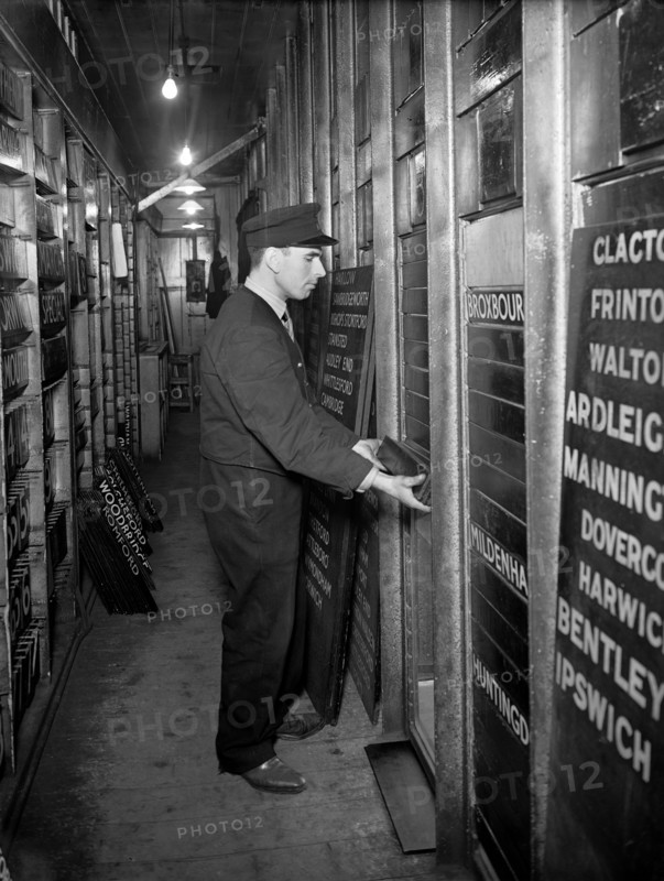 Member of staff changing departure information, Liverpool Street Station, London, 1950