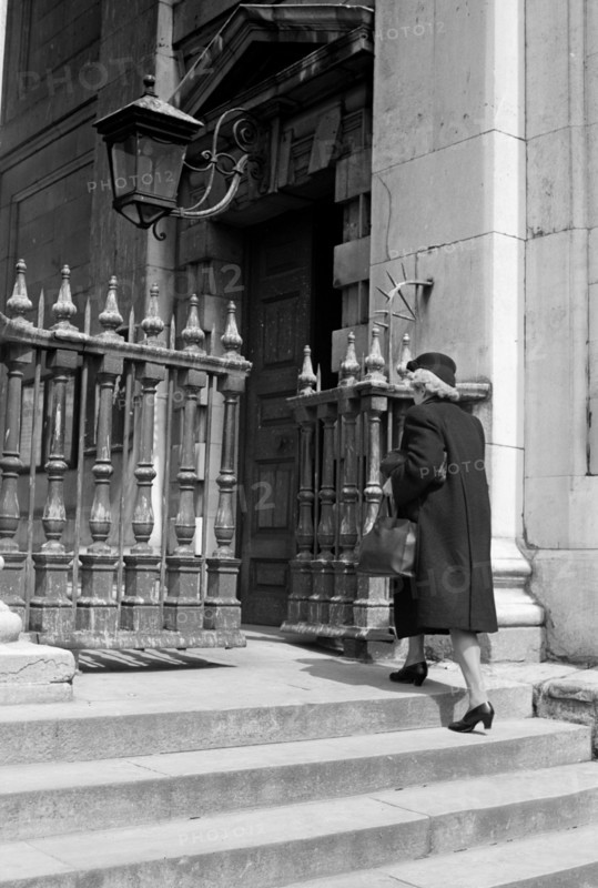 Woman entering the church of St Martin in the Fields, London, c1950