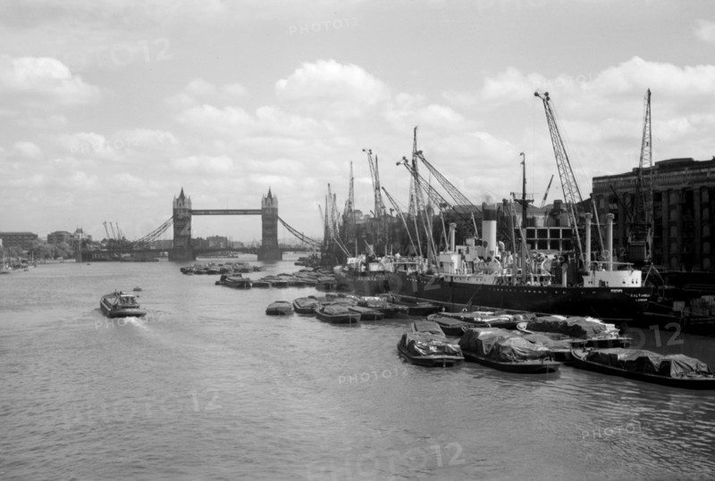 Tower Bridge with shipping in the Pool of London and at Hay's Wharf, Southwark, London, c1945-c1965