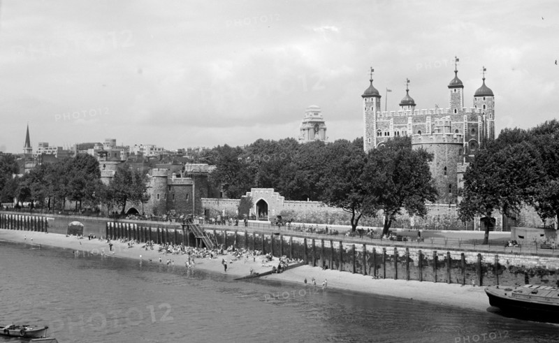 People relaxing on Tower Beach, London, c1945-c1955