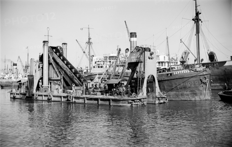 A dredger moored in Tilbury Docks, Essex, c1945-c1965
